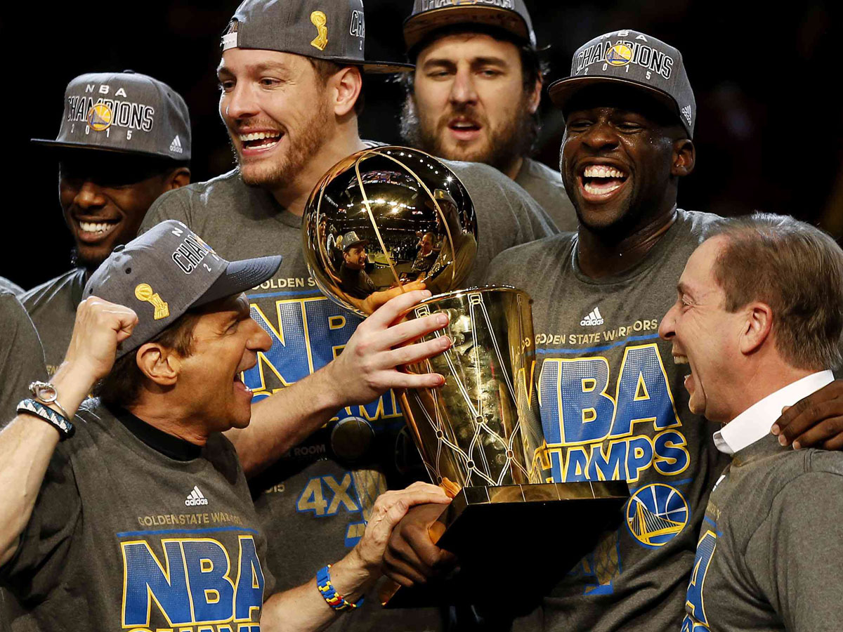 Peter Guber and Joe Lacob celebrate the 2015 NBA Championship with their team, the Golden State Warriors