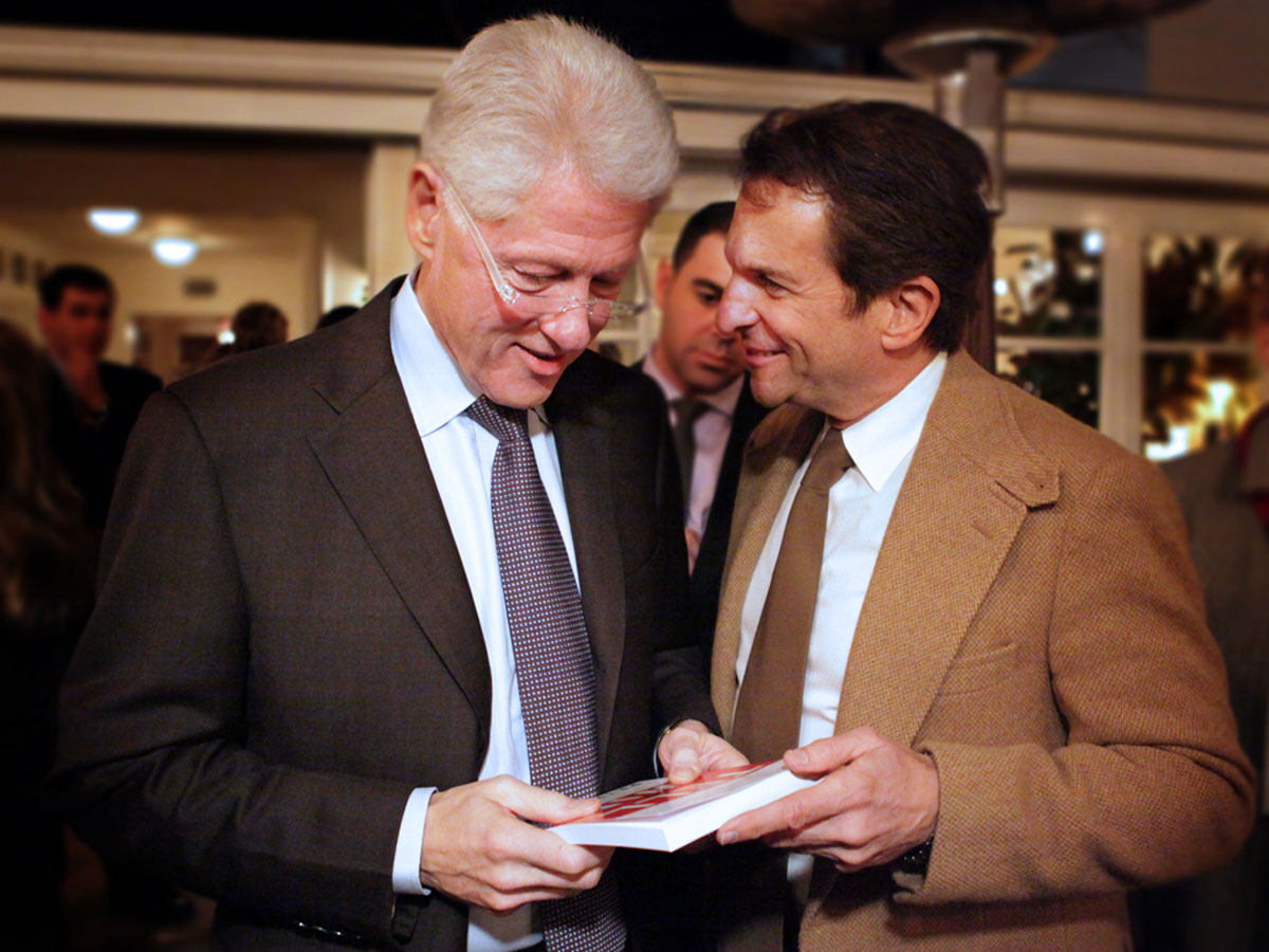 Peter shares a pre-print Galley Proof of Tell To Win with President Bill Clinton.