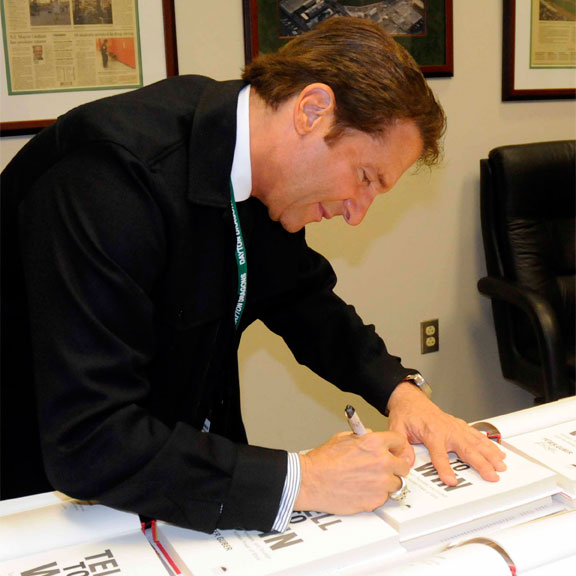 Peter Guber Signing his #1 New York Times Bestseller Tell To Win